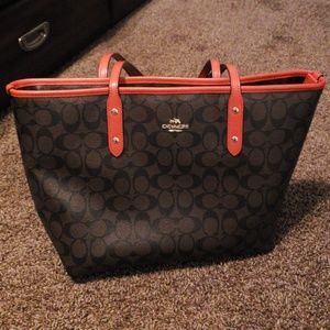 Brown and orange coach purse